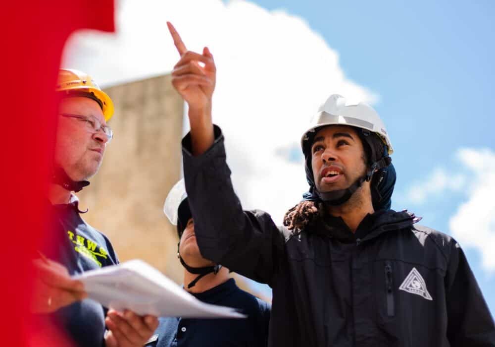 Man wearing a jacket and a hard hat