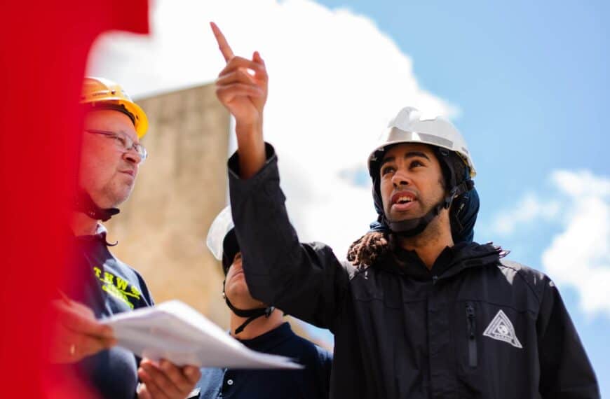 Man wearing a jacket and a hard hat