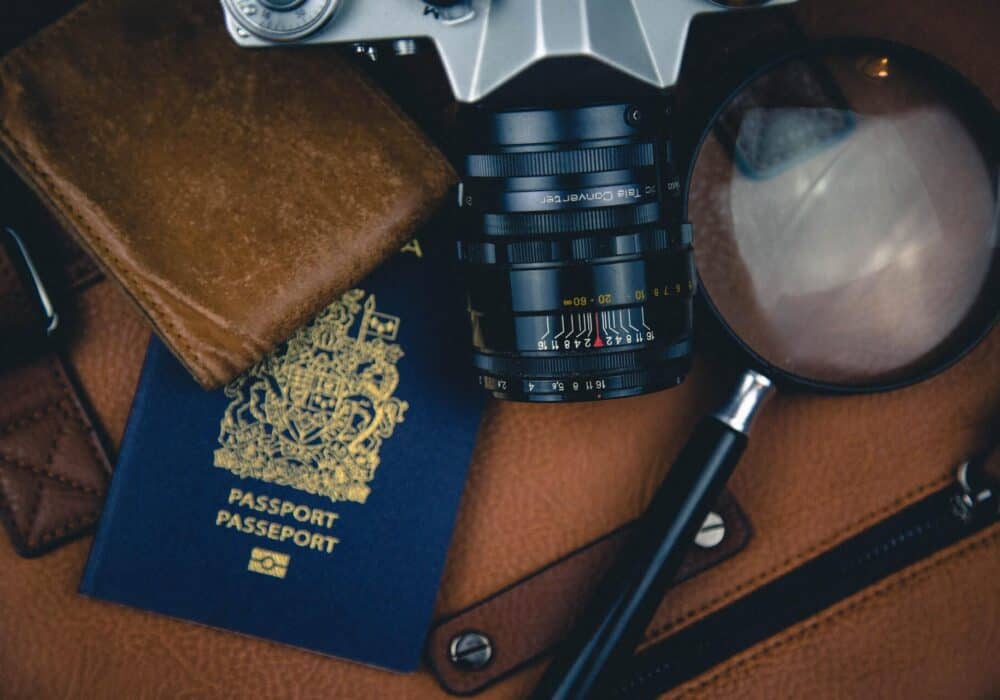 Camera, magnifying lens and passport
